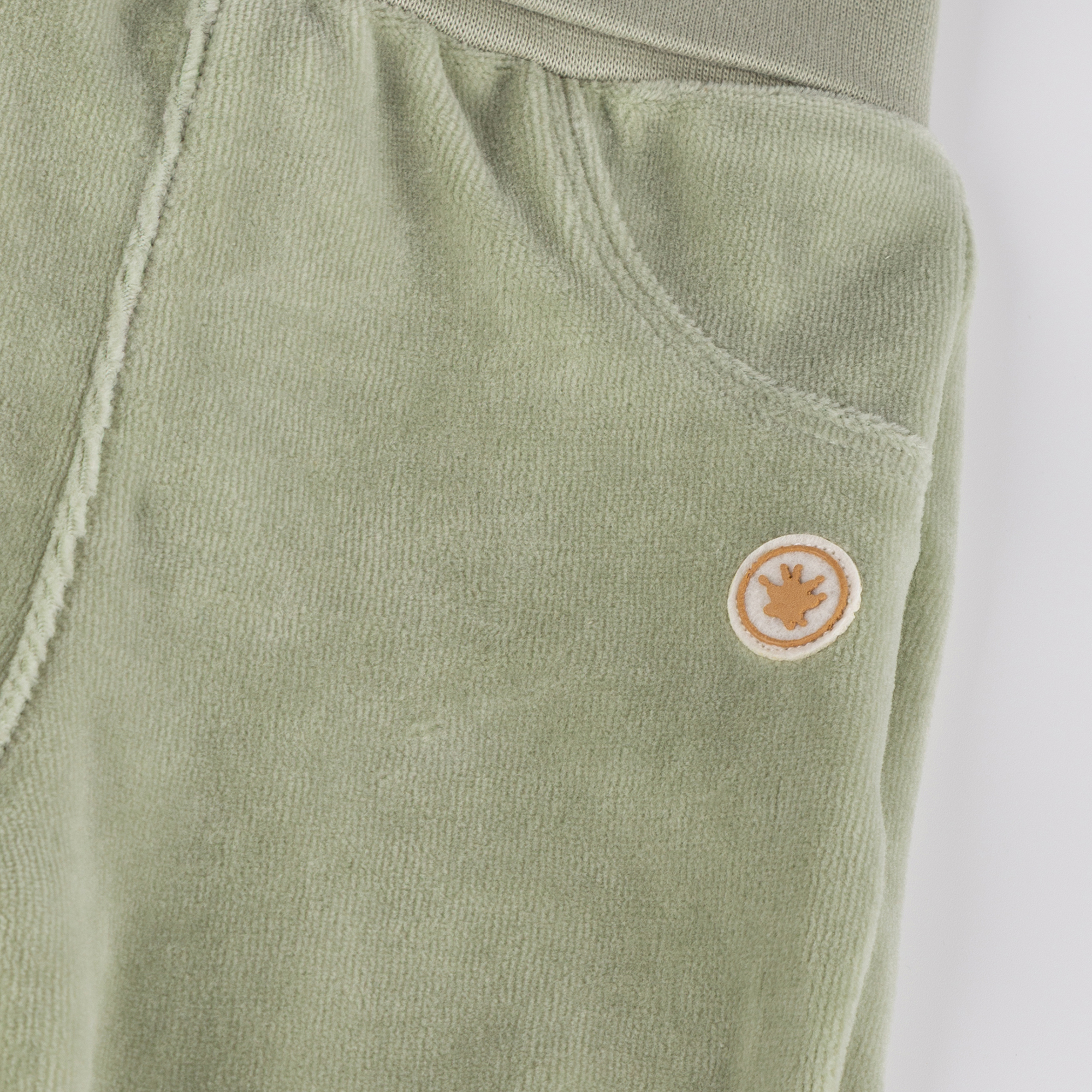 Newborn baby footed velour pants, green