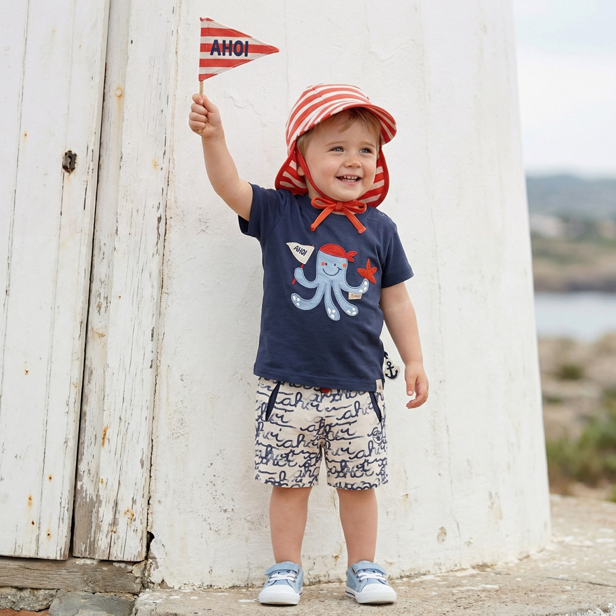 Baby Sonnenhut mit Nackenschutz, rot-weiß geringelt