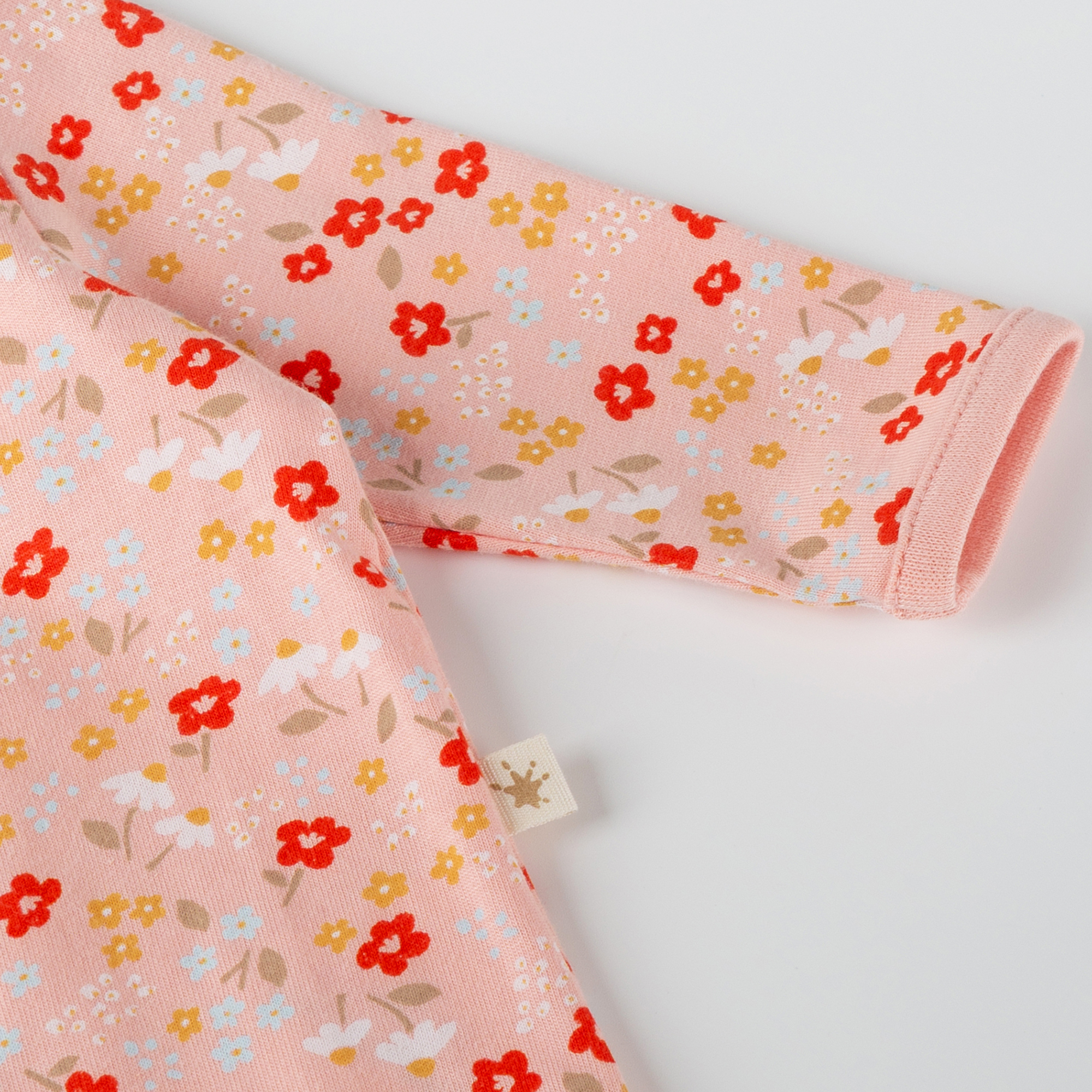 Flowery newborn baby footed romper, long sleeves